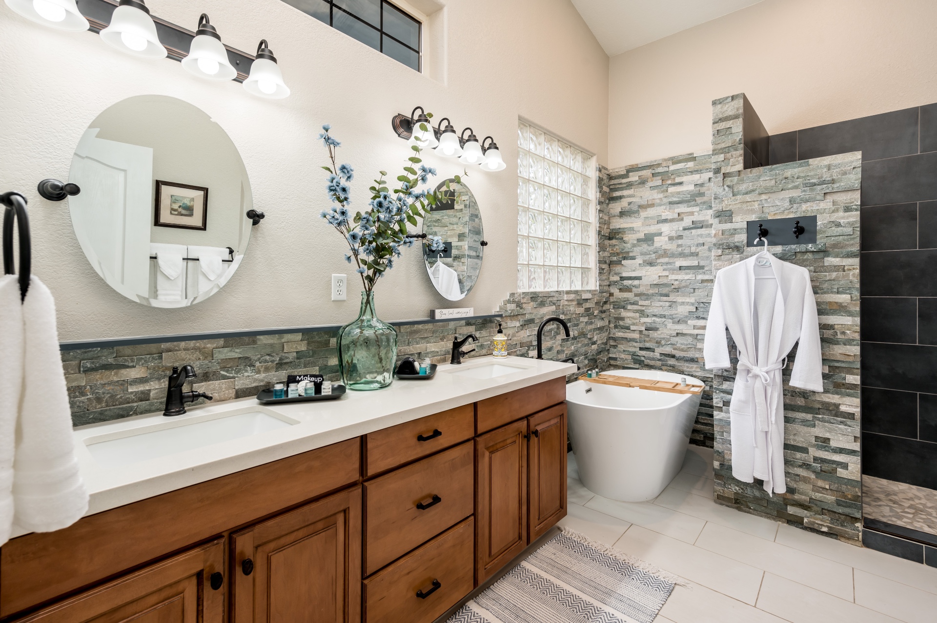 Primary bathroom with double vanity, soaking tub and walk-in shower