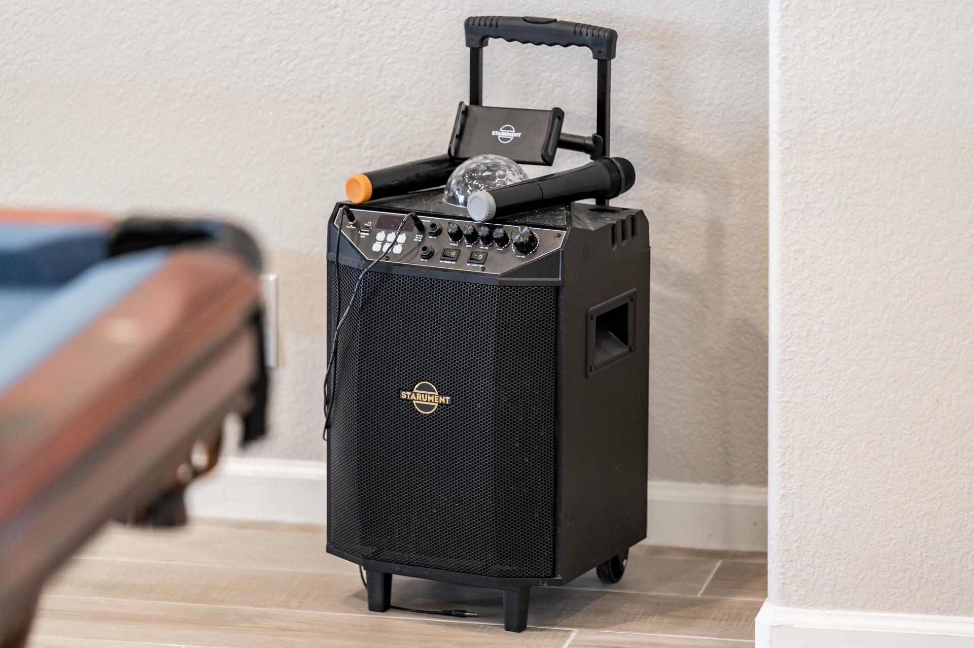 Portable karaoke speaker with wireless microphones and disco light
