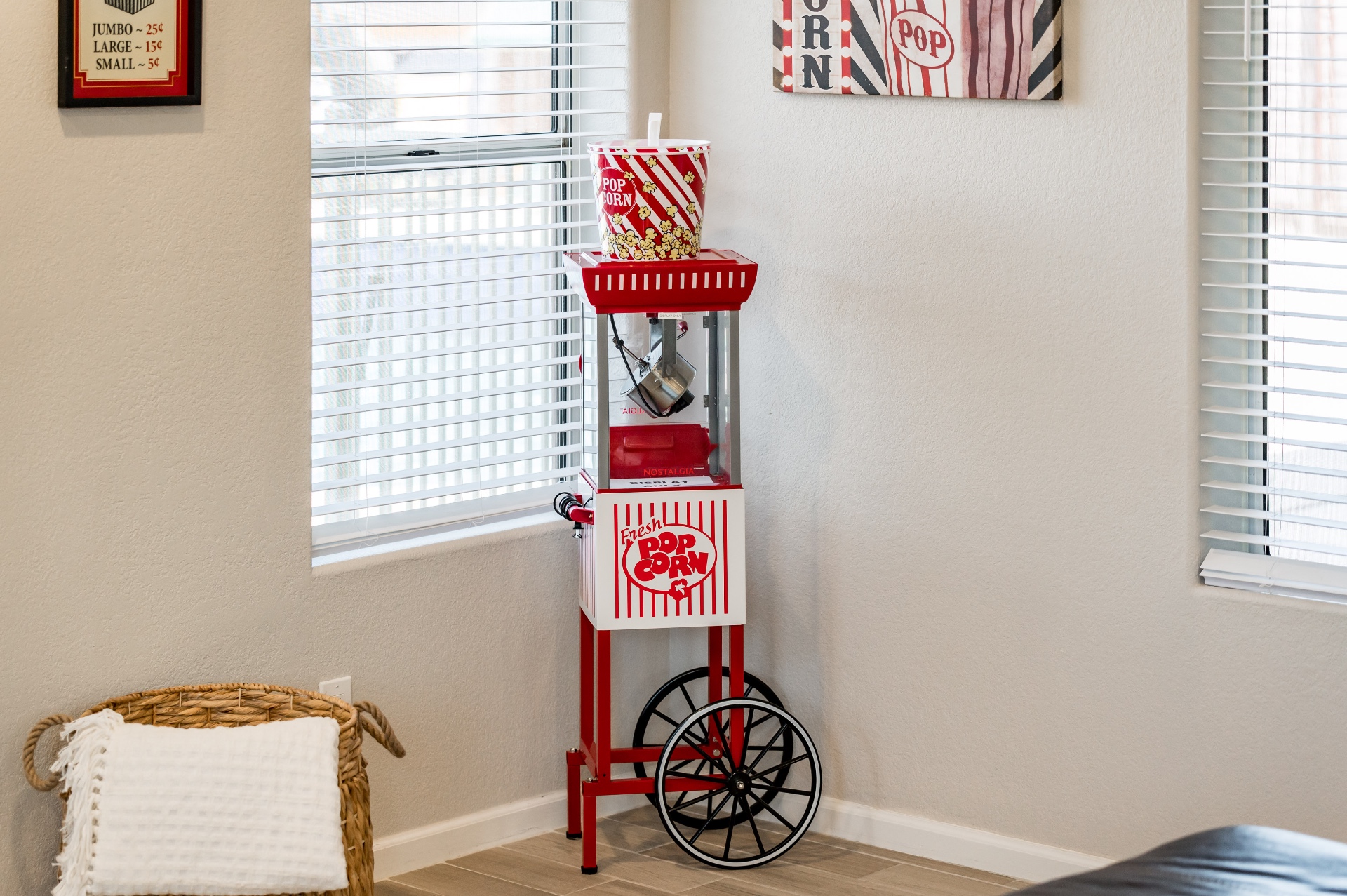 Vintage red popcorn cart in the movie-themed living room