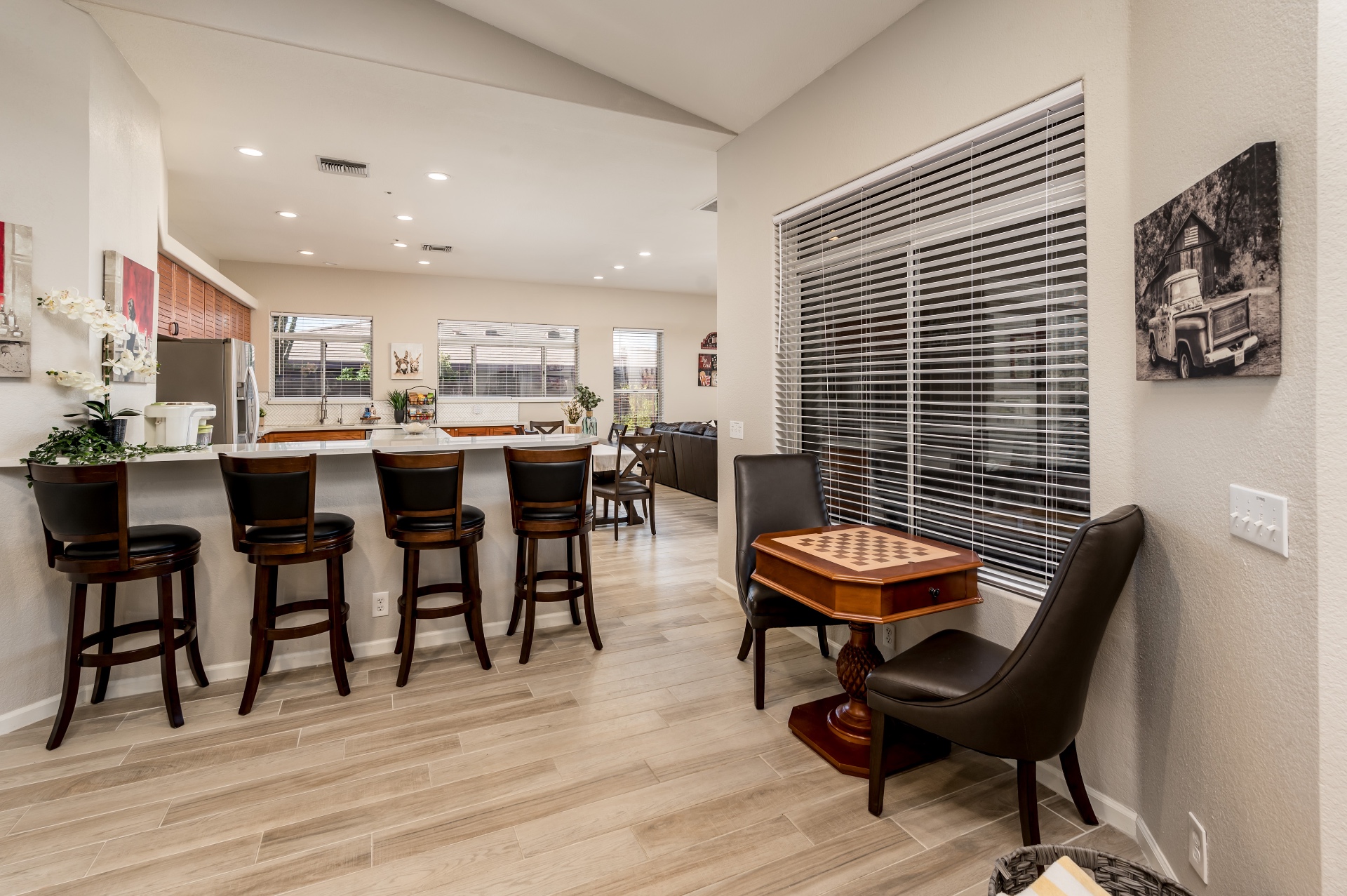 Kitchen bar stools and dining area with chess table