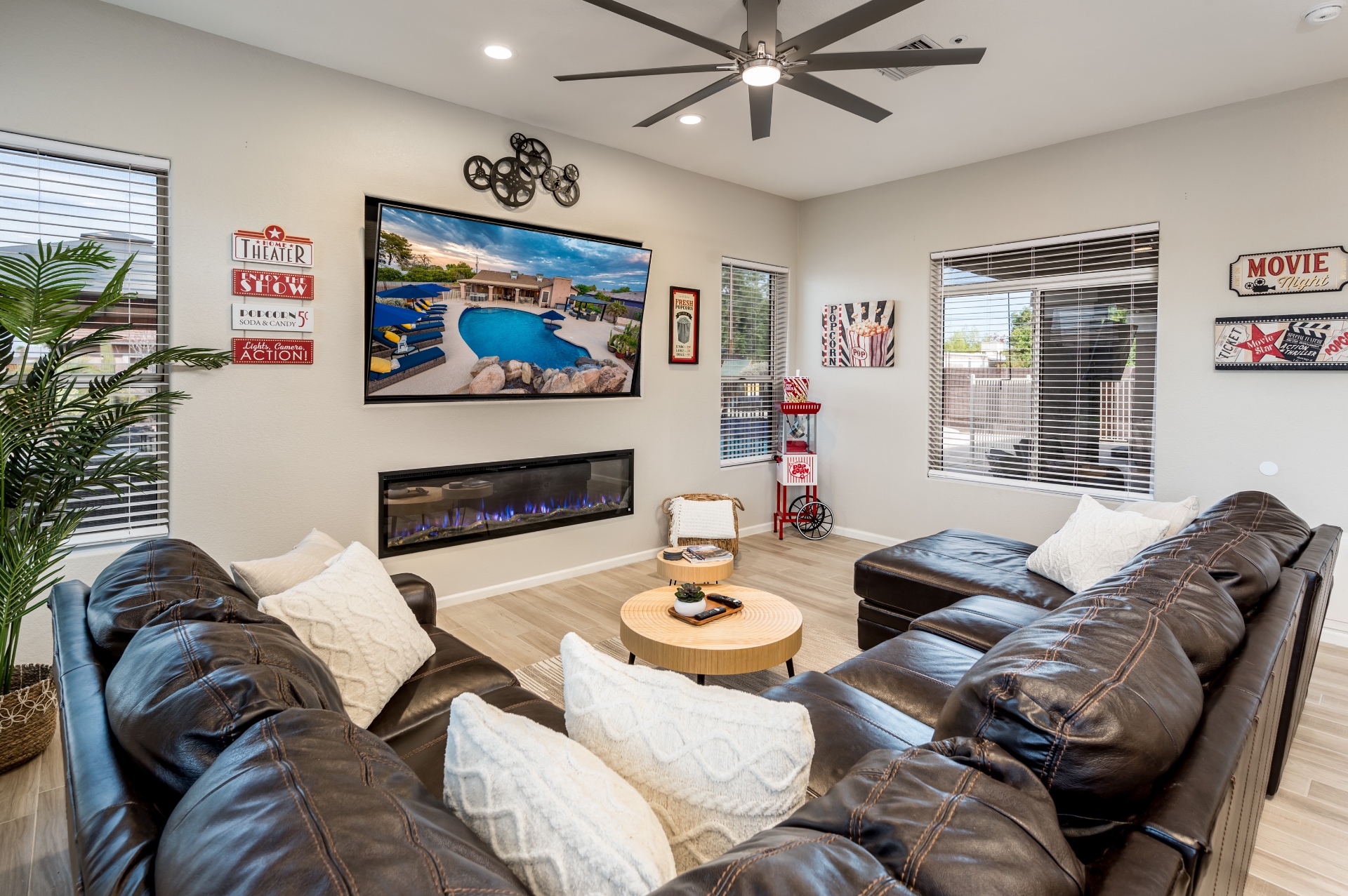 Movie-night living room with sectionals, popcorn cart and fireplace