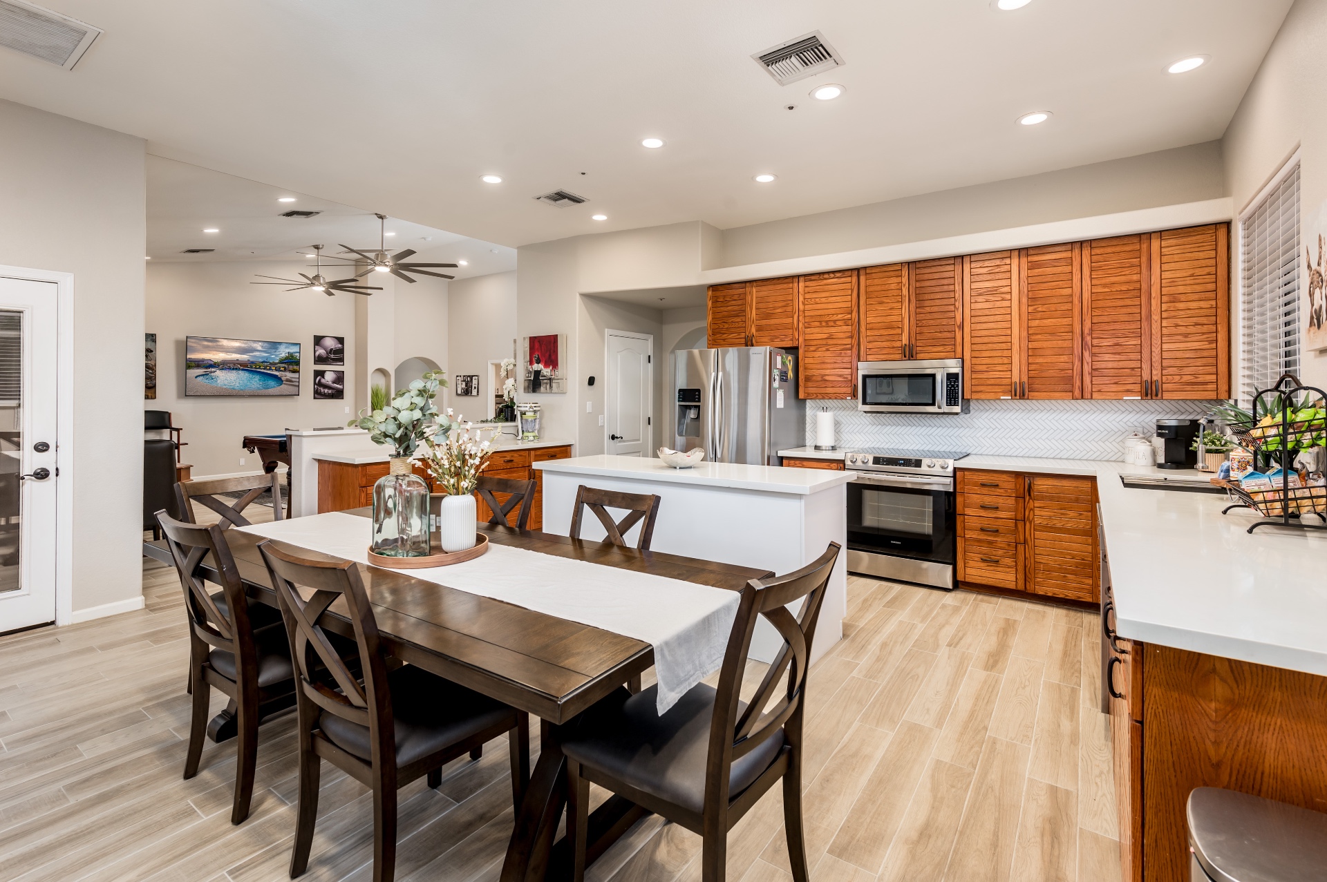 Open kitchen with quartz island and dining area at our Peoria, Arizona vacation rental